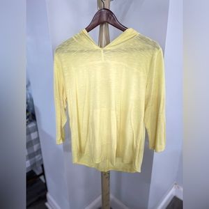 Yellow long sleeve tee shirt with hood.